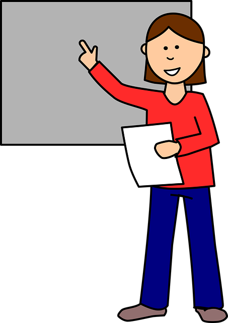 Teacher in front of a chalkboard